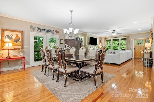 51 Cherry Ridge Ln, Weaverville, NC 28787 - dining space with healthy amount of natural light, light wood-style flooring, a chandelier, ornamental molding, and baseboards