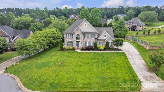 604 Gwendolyn Ct, Granite Falls, NC 28630 - georgian-style home with driveway, a front yard, and stone siding