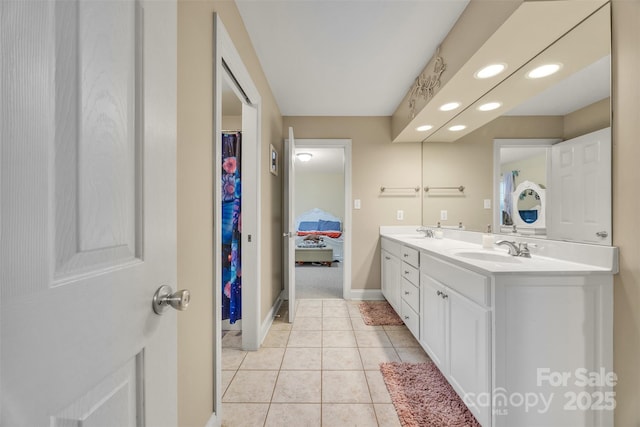 604 Gwendolyn Ct, Granite Falls, NC 28630 - ensuite bathroom featuring double vanity, tile patterned floors, and recessed lighting