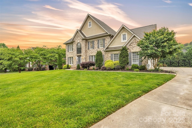 604 Gwendolyn Ct, Granite Falls, NC 28630 - colonial inspired home featuring a lawn and stucco siding
