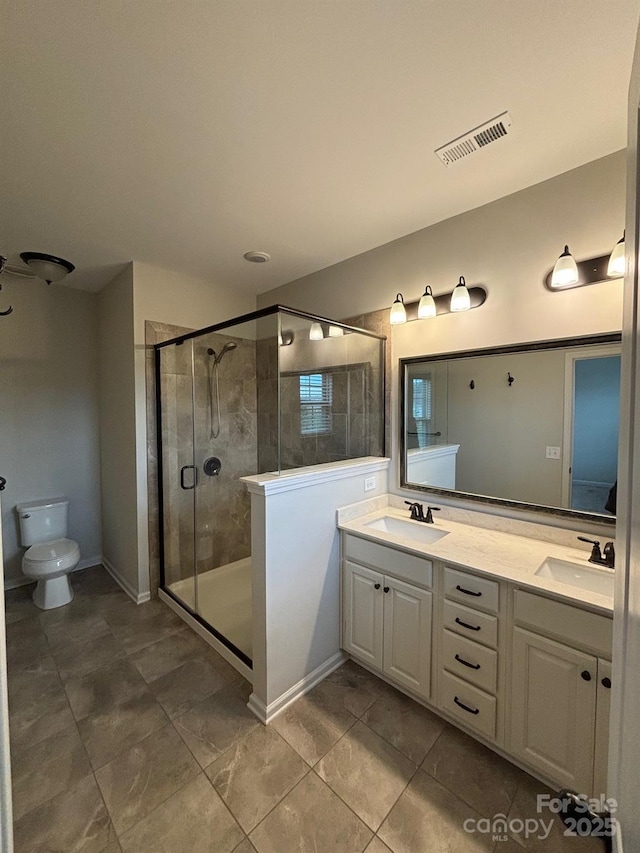 9236 Ainslie Downs St, Charlotte, NC 28273 - full bath featuring double vanity, a shower stall, toilet, and tile patterned floors