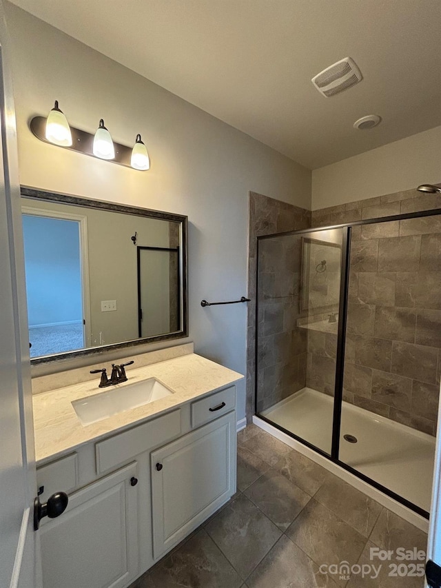 9236 Ainslie Downs St, Charlotte, NC 28273 - bathroom featuring a stall shower, vanity, and tile patterned floors