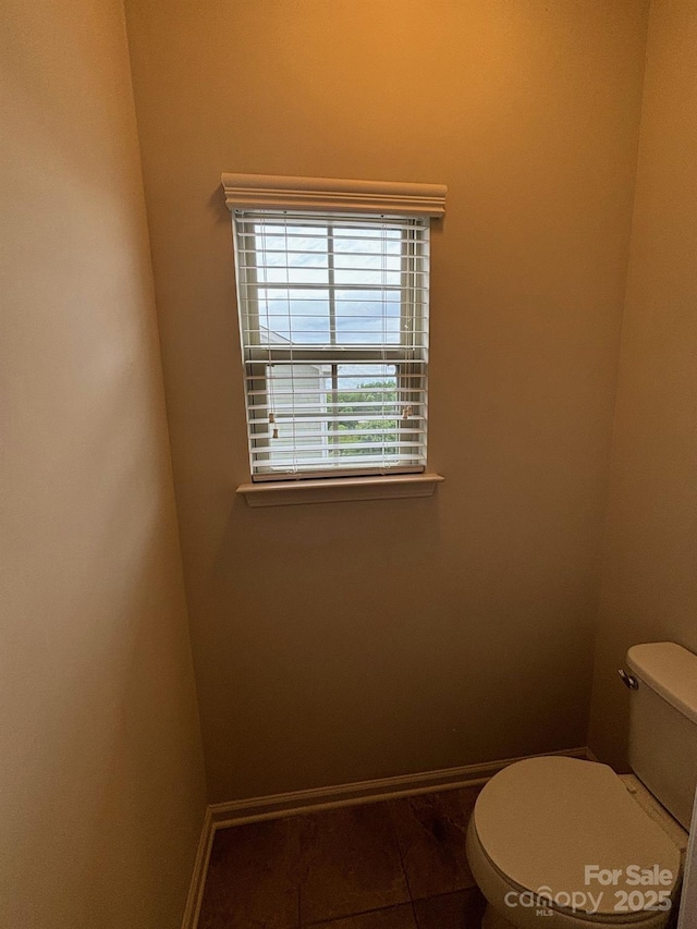 9236 Ainslie Downs St, Charlotte, NC 28273 - bathroom featuring toilet and baseboards