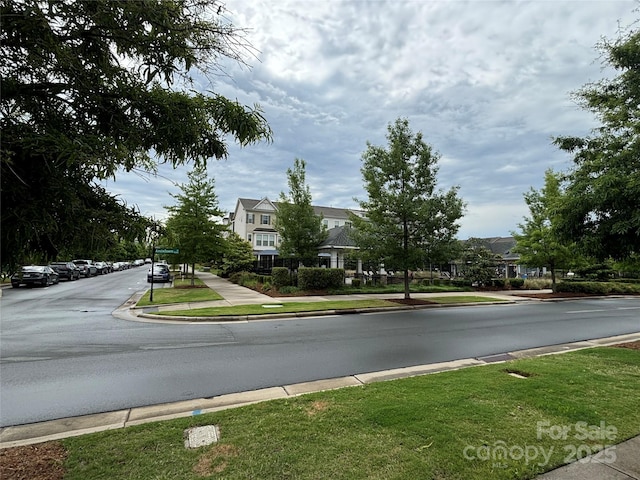 9236 Ainslie Downs St, Charlotte, NC 28273 - view of asphalt street featuring sidewalks and curbs