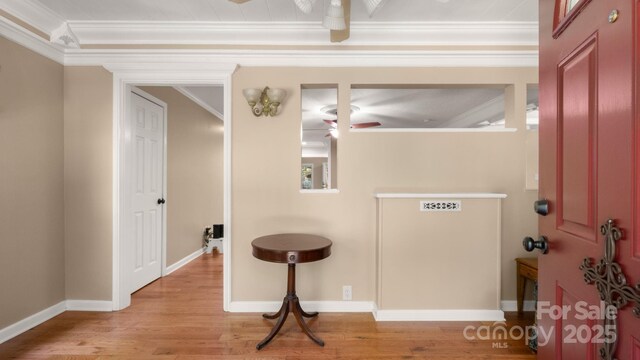 8321 Walkup Rd, Waxhaw, NC 28173 - hallway with ornamental molding and light wood finished floors