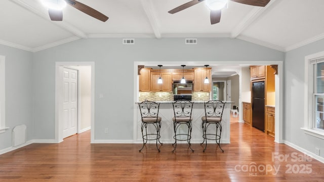 8321 Walkup Rd, Waxhaw, NC 28173 - kitchen with a ceiling fan, freestanding refrigerator, and light wood-style flooring
