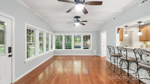 8321 Walkup Rd, Waxhaw, NC 28173 - unfurnished sunroom with wood finished floors and ornamental molding
