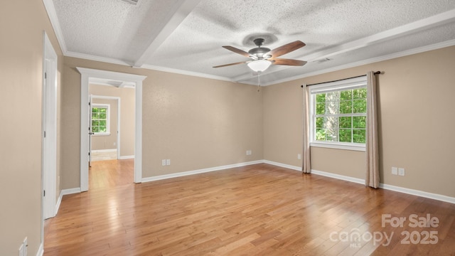 8321 Walkup Rd, Waxhaw, NC 28173 - empty room with ceiling fan, a textured ceiling, healthy amount of natural light, light wood-style floors, and crown molding