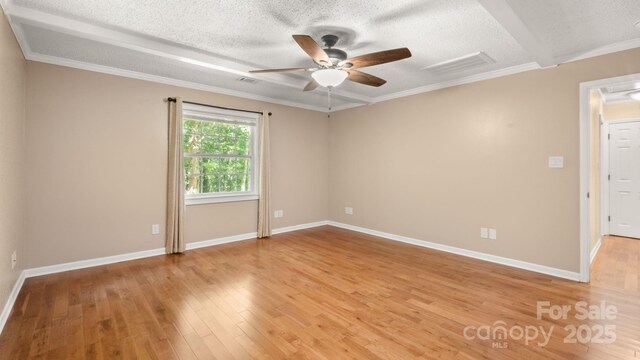 8321 Walkup Rd, Waxhaw, NC 28173 - spare room featuring ceiling fan, a textured ceiling, light wood-style floors, and ornamental molding