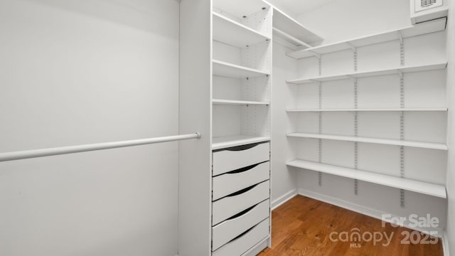 8321 Walkup Rd, Waxhaw, NC 28173 - walk in closet featuring wood finished floors