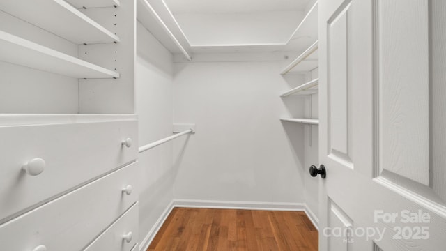 8321 Walkup Rd, Waxhaw, NC 28173 - walk in closet with wood finished floors