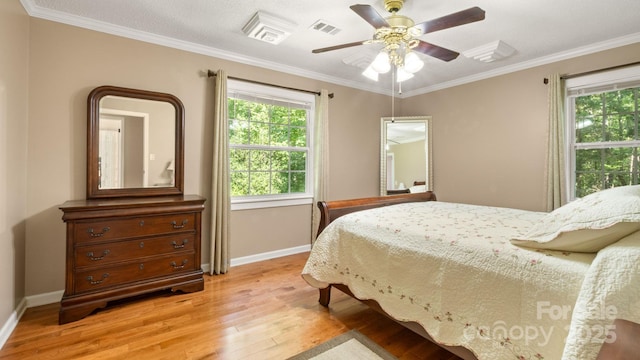 8321 Walkup Rd, Waxhaw, NC 28173 - bedroom featuring light wood-style floors, crown molding, and a ceiling fan