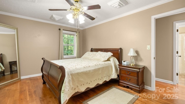 8321 Walkup Rd, Waxhaw, NC 28173 - bedroom with crown molding, wood finished floors, and a ceiling fan