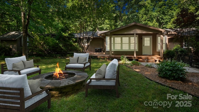 8321 Walkup Rd, Waxhaw, NC 28173 - rear view of house with an outdoor living space with a fire pit