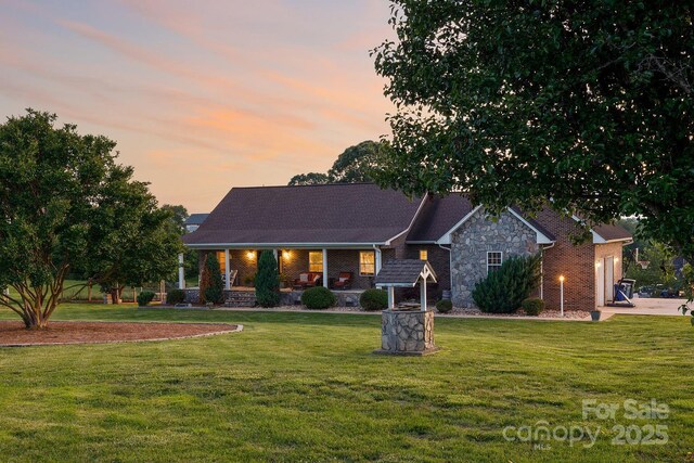 2843 Startown Rd, Lincolnton, NC 28092 - view of front of property with a porch, a lawn, and stone siding