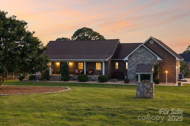 2843 Startown Rd, Lincolnton, NC 28092 - view of front facade with a front lawn, stone siding, and covered porch