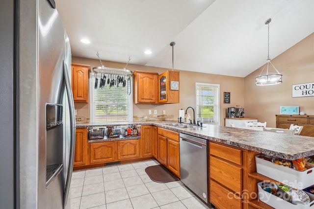 2843 Startown Rd, Lincolnton, NC 28092 - kitchen featuring appliances with stainless steel finishes, a sink, a peninsula, lofted ceiling, and brown cabinets