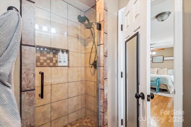 2843 Startown Rd, Lincolnton, NC 28092 - full bath featuring ensuite bathroom, a stall shower, wood finished floors, and a ceiling fan