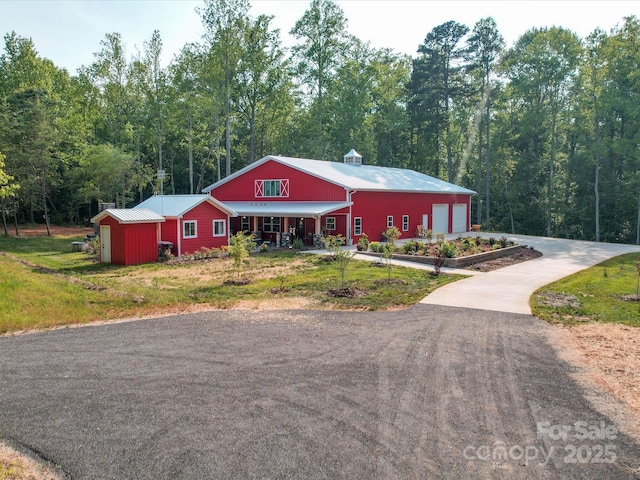 574 Crescent Rd, Rockwell, NC 28138 - view of front of property featuring asphalt driveway, a porch, and metal roof