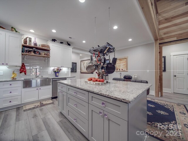 574 Crescent Rd, Rockwell, NC 28138 - kitchen featuring a sink, dishwasher, backsplash, white cabinets, and a center island