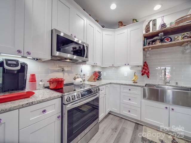 574 Crescent Rd, Rockwell, NC 28138 - kitchen featuring appliances with stainless steel finishes, a sink, white cabinetry, and recessed lighting