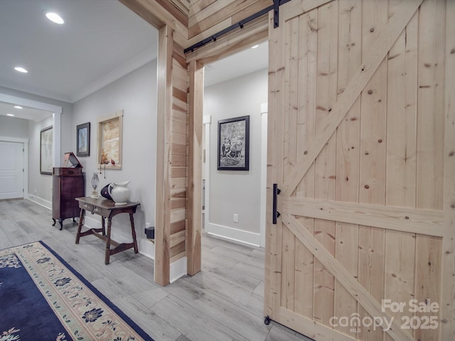 574 Crescent Rd, Rockwell, NC 28138 - hallway with a barn door, baseboards, wood finished floors, recessed lighting, and crown molding