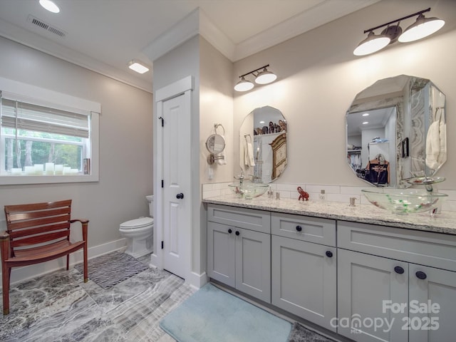 574 Crescent Rd, Rockwell, NC 28138 - full bathroom with a closet, crown molding, vanity, toilet, and baseboards