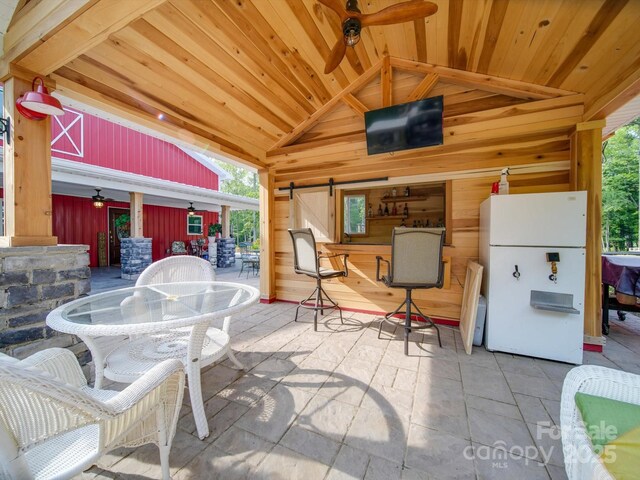574 Crescent Rd, Rockwell, NC 28138 - view of patio with ceiling fan, a bar, and outdoor dining area