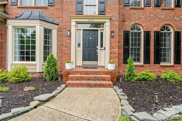 6432 Morningsong Ln, Charlotte, NC 28269 - doorway to property featuring brick siding