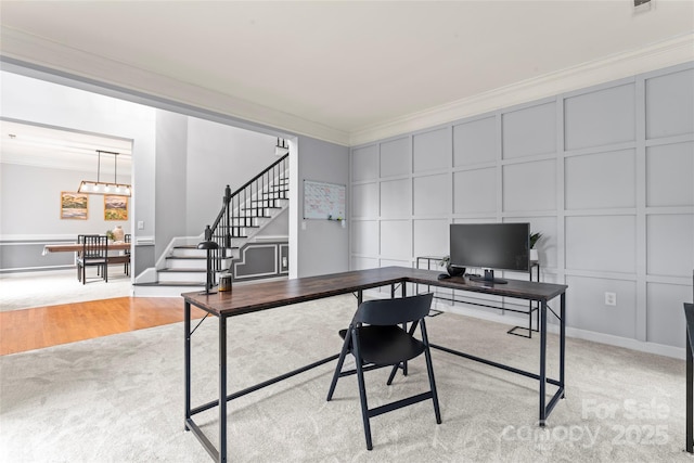 6432 Morningsong Ln, Charlotte, NC 28269 - office area with a decorative wall, ornamental molding, light carpet, and a chandelier