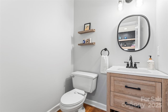6432 Morningsong Ln, Charlotte, NC 28269 - bathroom featuring vanity, toilet, baseboards, and wood finished floors