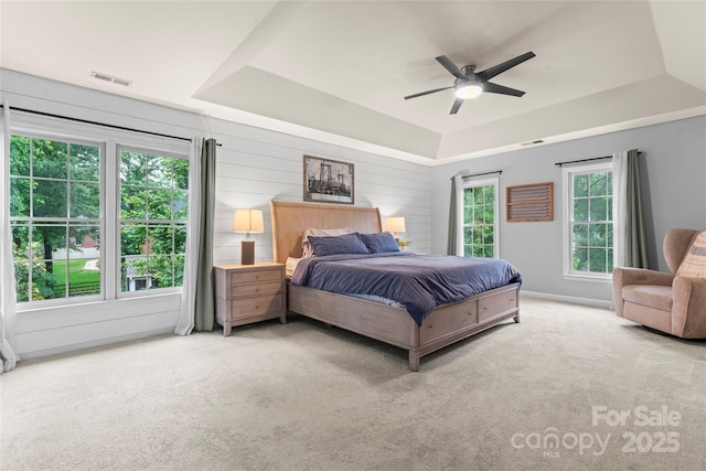 6432 Morningsong Ln, Charlotte, NC 28269 - carpeted bedroom with a raised ceiling and a ceiling fan