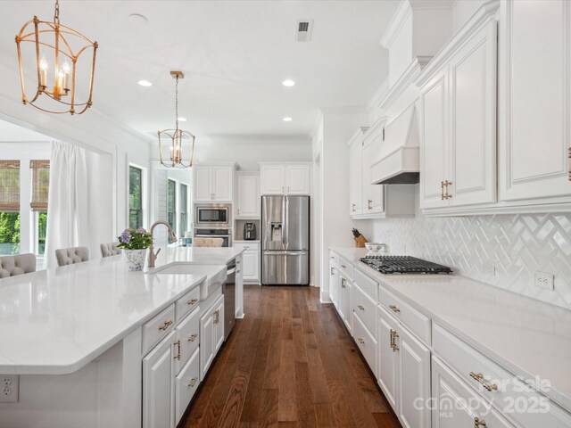 435 Galbreath Ct Unit 128, Fort Mill, SC 29708 - kitchen with appliances with stainless steel finishes, a chandelier, white cabinets, backsplash, and recessed lighting