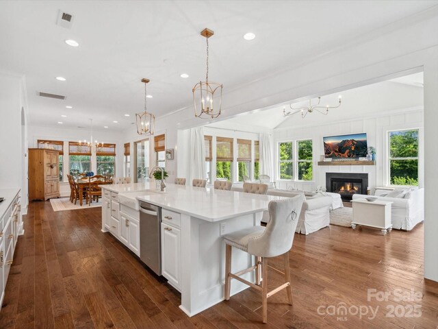 435 Galbreath Ct Unit 128, Fort Mill, SC 29708 - kitchen with stainless steel dishwasher, a chandelier, a sink, open floor plan, and white cabinetry