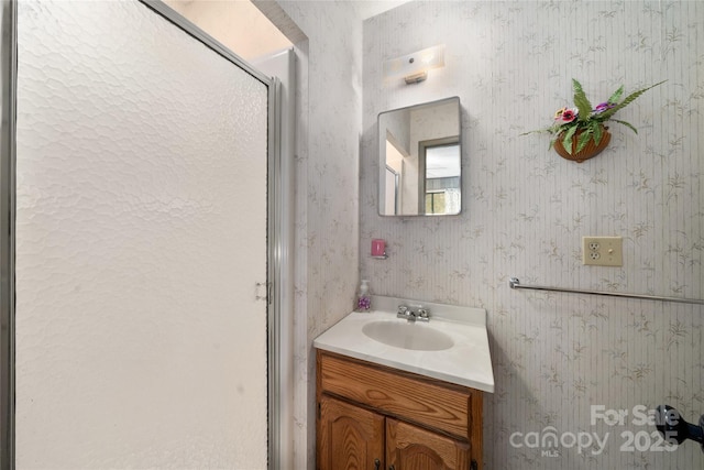 90 Eagles Nest Ln, Maggie Valley, NC 28751 - bathroom with vanity, wallpapered walls, and a shower with door