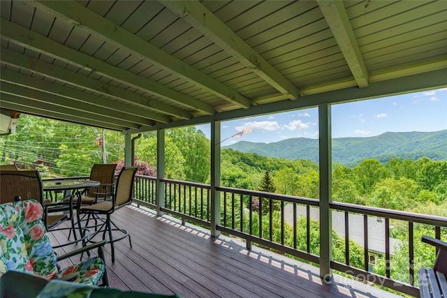 90 Eagles Nest Ln, Maggie Valley, NC 28751 - wooden terrace featuring a mountain view, a view of trees, and outdoor dining space