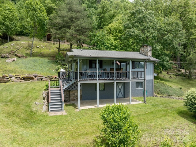 90 Eagles Nest Ln, Maggie Valley, NC 28751 - back of house with a patio, a chimney, stairs, a deck, and a yard