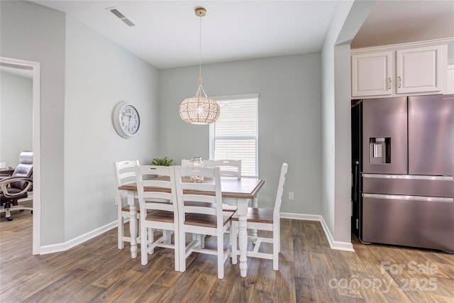 1077 River Haven Ave SW, Concord, NC 28025 - dining room with wood finished floors and baseboards