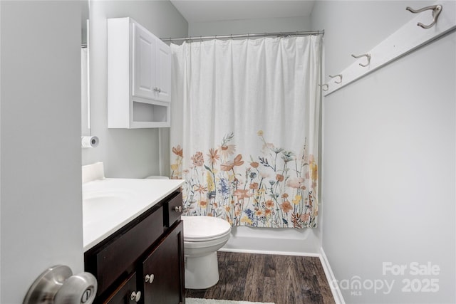1077 River Haven Ave SW, Concord, NC 28025 - full bathroom featuring wood finished floors, vanity, toilet, and baseboards