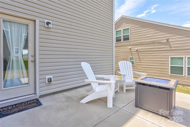 1077 River Haven Ave SW, Concord, NC 28025 - view of patio / terrace with an outdoor fire pit