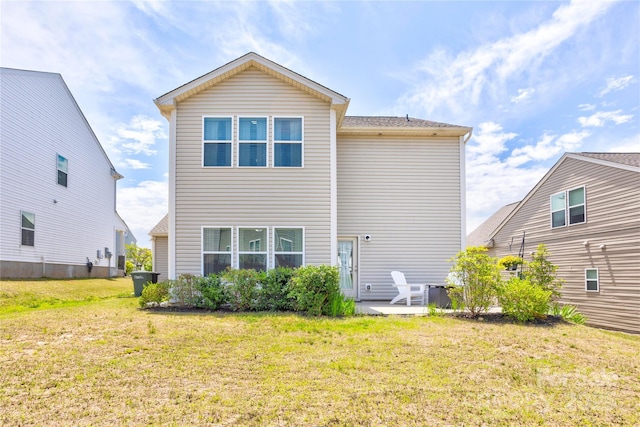 1077 River Haven Ave SW, Concord, NC 28025 - back of house featuring a lawn and a patio area