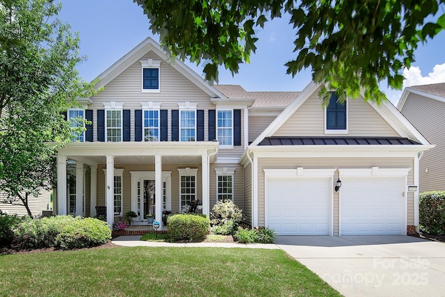 10792 Elsfield Ave NW, Concord, NC 28027 - traditional-style home with driveway, a porch, a front lawn, a standing seam roof, and an attached garage