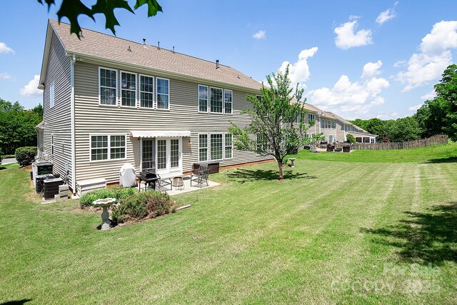 10792 Elsfield Ave NW, Concord, NC 28027 - rear view of house with a patio area and a yard