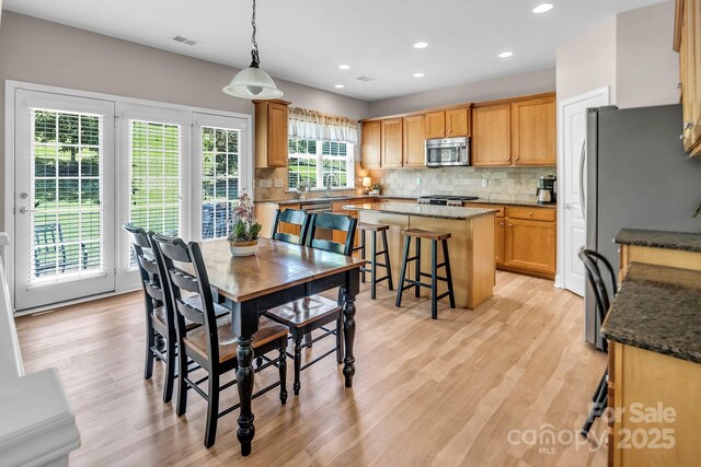 10792 Elsfield Ave NW, Concord, NC 28027 - dining area with light wood-type flooring and recessed lighting