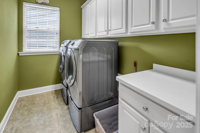 10792 Elsfield Ave NW, Concord, NC 28027 - laundry room with cabinet space, washing machine and clothes dryer, baseboards, and light tile patterned flooring