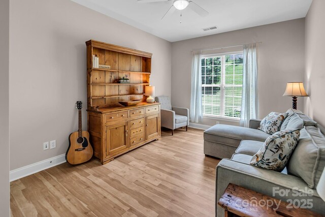 10792 Elsfield Ave NW, Concord, NC 28027 - sitting room with ceiling fan, baseboards, and light wood-style flooring