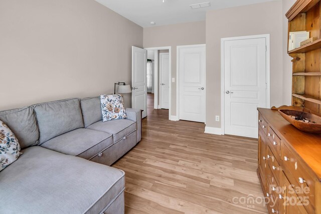 10792 Elsfield Ave NW, Concord, NC 28027 - living room with light wood-type flooring and baseboards