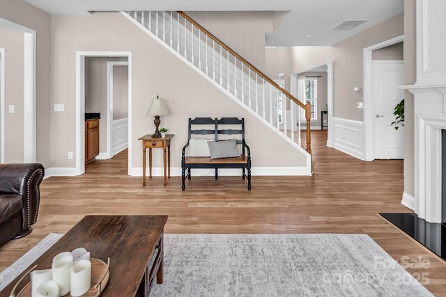 10792 Elsfield Ave NW, Concord, NC 28027 - living area with stairs and light wood finished floors