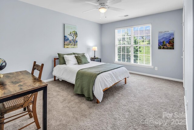 10792 Elsfield Ave NW, Concord, NC 28027 - bedroom with baseboards, light colored carpet, and a ceiling fan