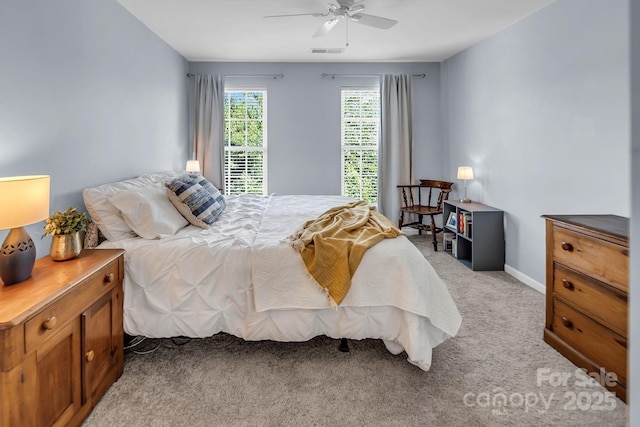 10792 Elsfield Ave NW, Concord, NC 28027 - bedroom with light colored carpet, ceiling fan, and baseboards